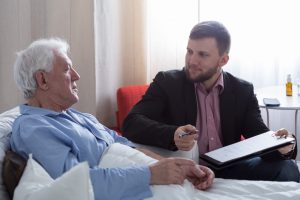 Senior talking to lawyer about his will